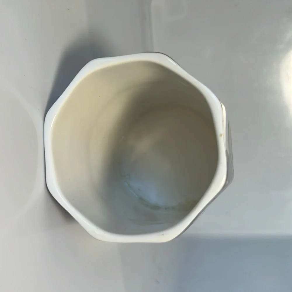 Ceramic cup, purple, gold, white.